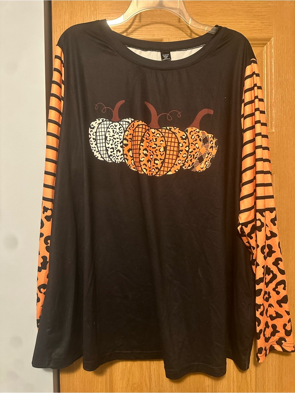 SHEIN Black Long-Sleeve Top with Orange Pumpkin Graphic
